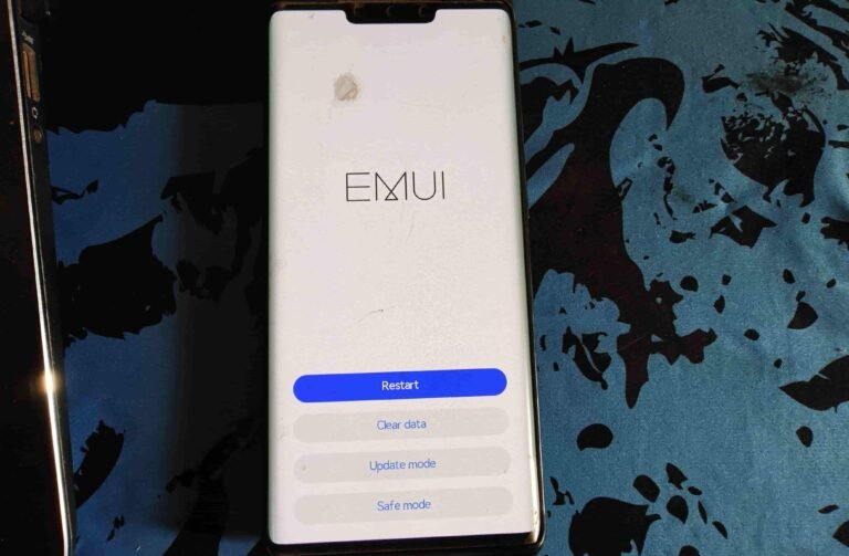 Smartphone displaying the EMUI recovery menu with options: Restart, Clear data, Update mode, and Safe mode.